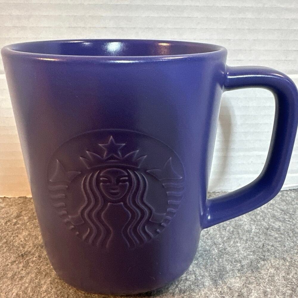 Starbucks coffee mug , purple made with recycled cetamic. 16 oz